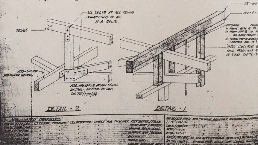 Paper plans for an elevated house.