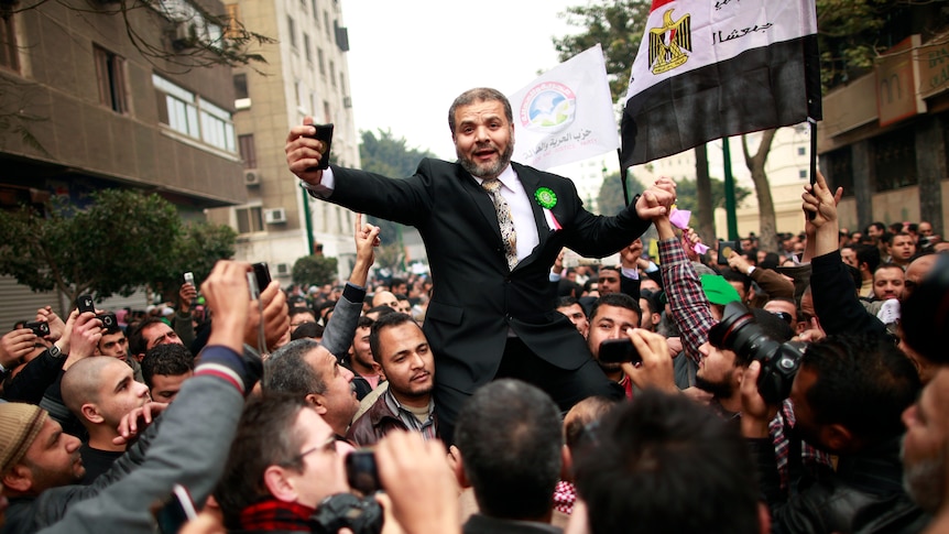Muslim Brotherhood supporters celebrate outside Egypt's parliament in Cairo