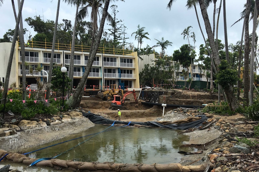 A lagoon of water surrounded by a construction site