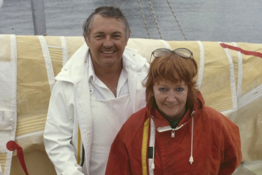 A man and a woman aboard a yacht in the 1980s