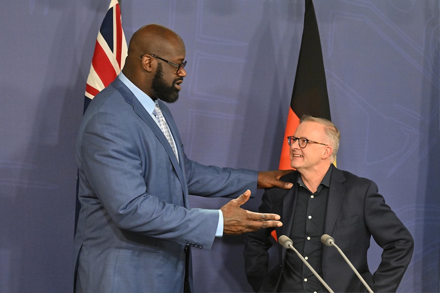 Shaquille O’Neal at a lectern with Anthony Albanese