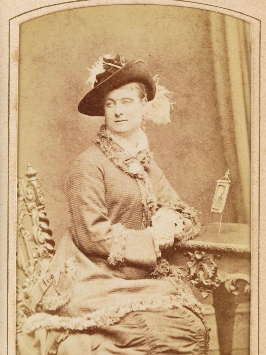 A sepia-tinted portrait of Madame Brussels.