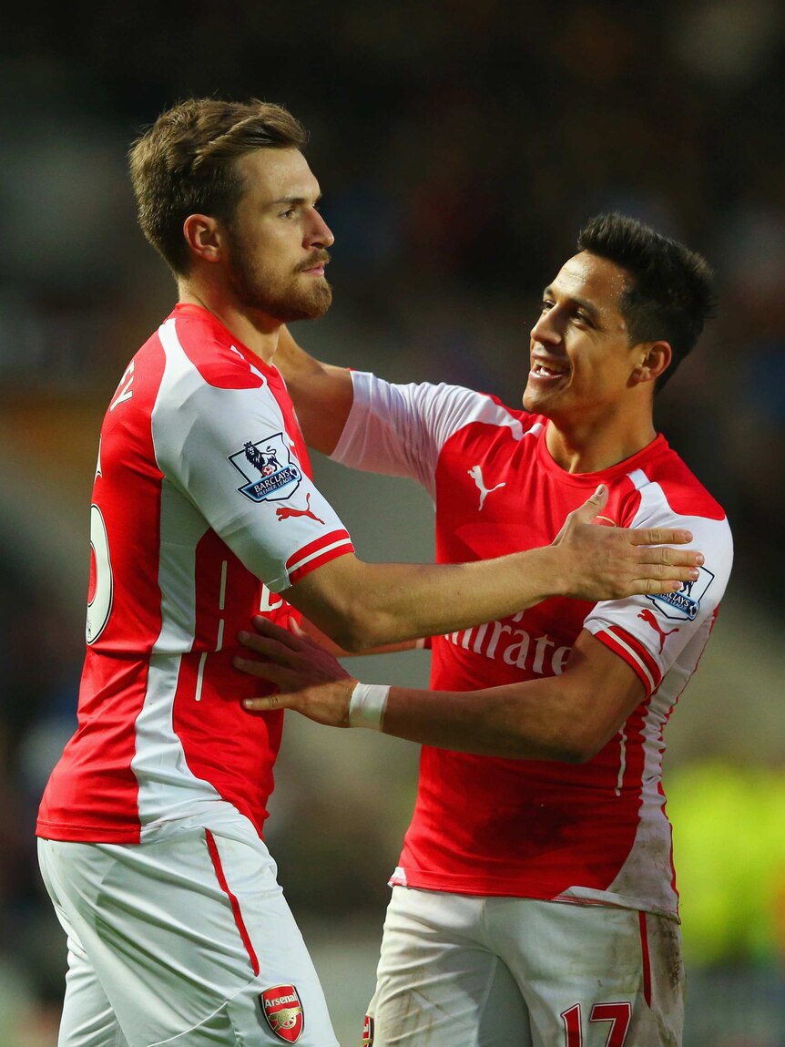 Arsenal's Aaron Ramsey celebrates with Alexis Sanchez