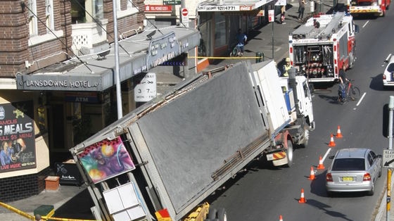 Load slips off turning truck