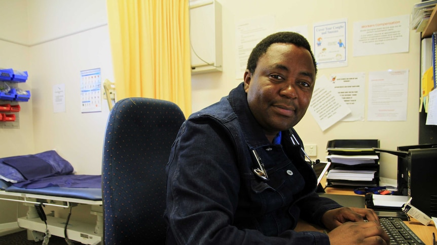Doctor Fred Machiri, pictured in his office, is a locum doctor at Bourke Aboriginal Medical Service.