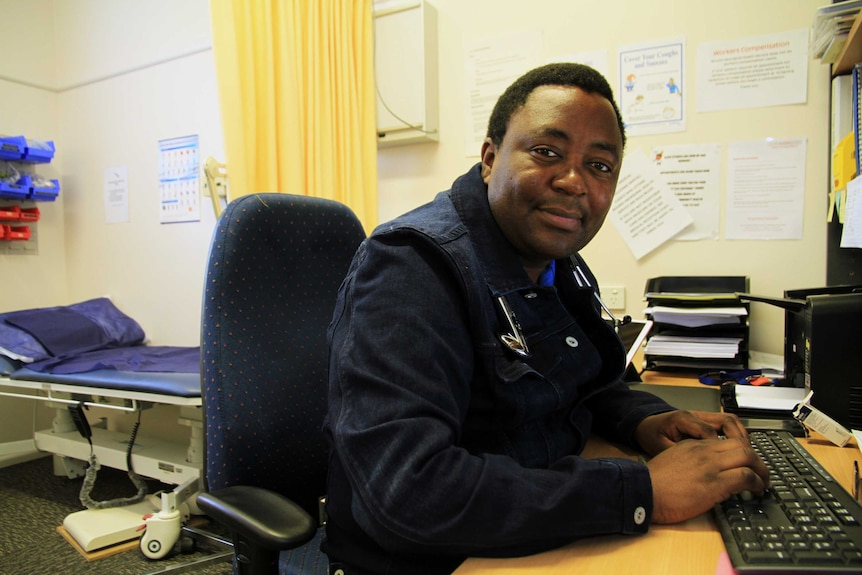 Doctor Fred Machiri, pictured in his office, is a locum doctor at Bourke Aboriginal Medical Service.