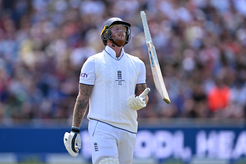 Ben Stokes looks disappointed while tossing his bat in the air and preparing to catch it