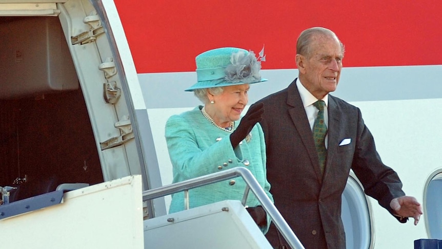 Queen Elizabeth and Prince Philip wave to the crowd on arrival in Canberra on October 19, 2011.