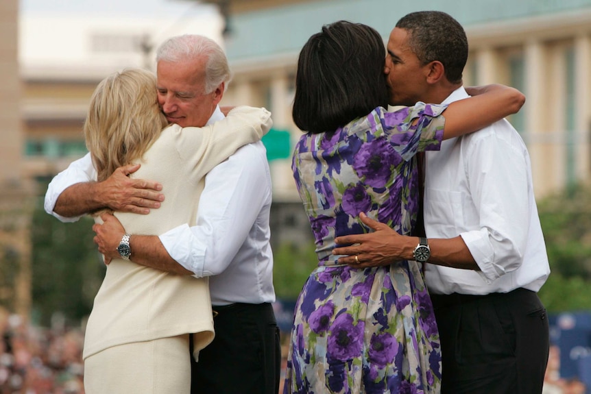 President Barack Obama and Vice President Joe Bidgen hug their wives, 2008.