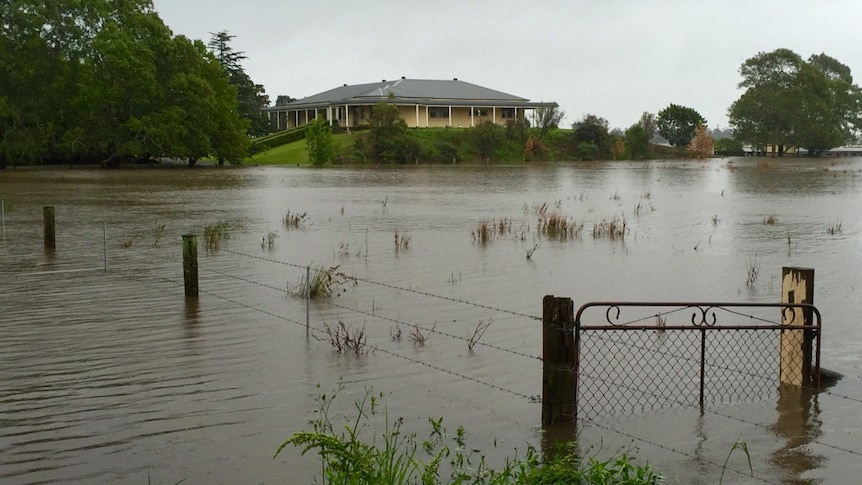 A house is surrounded by floodwaters in Raymond Terrace