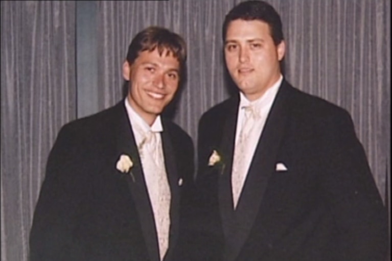 Two men wearing suits and ties