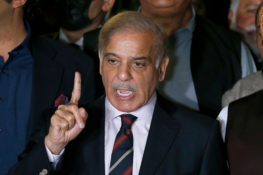 Pakistan's opposition leader Shahbaz Sharif holds his finger up as he speaks.