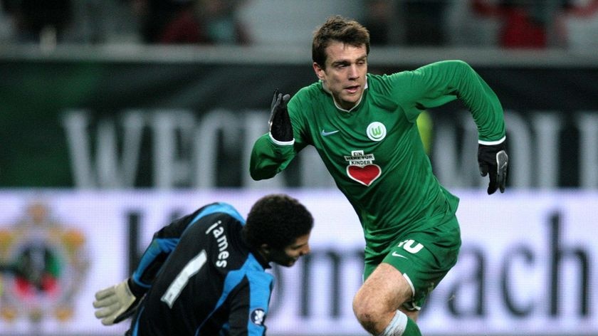 Wolfsburg's Zvjezdan Misimovic wrong foots Portsmouth's goalkeeper David James