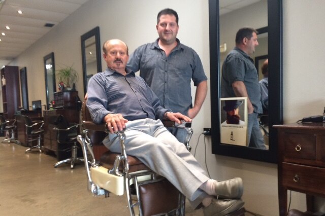 Ray and John Gissara in their barber shop today.