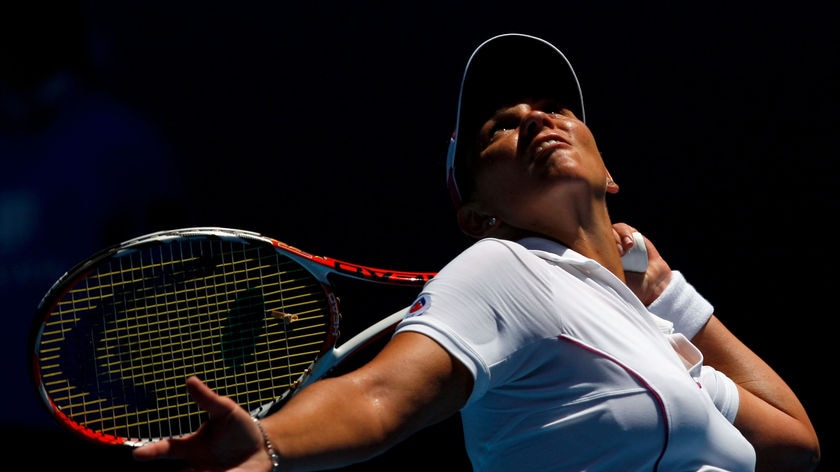 Casey Dellacqua serves