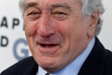 Actor Robert De Niro laughs as he arrives to receive his Chaplin Award from the Film Society of Lincoln Centre.