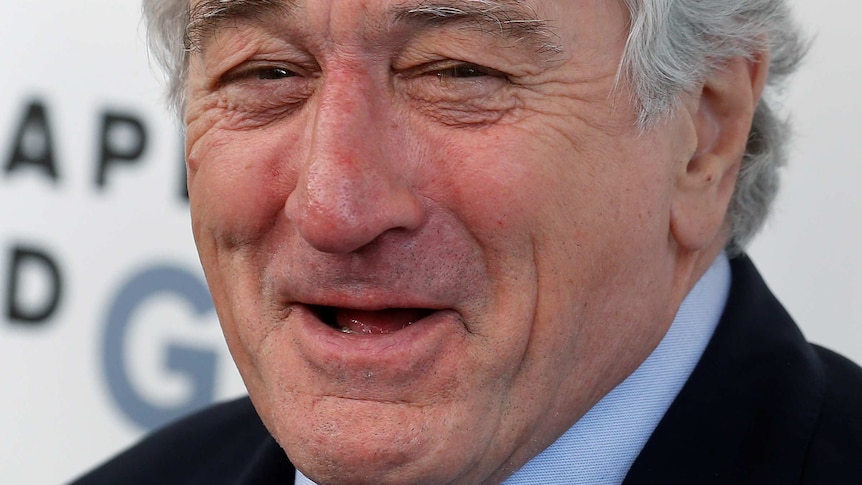 Actor Robert De Niro laughs as he arrives to receive his Chaplin Award from the Film Society of Lincoln Centre.