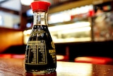 Bottle of soy sauce at restaurant.