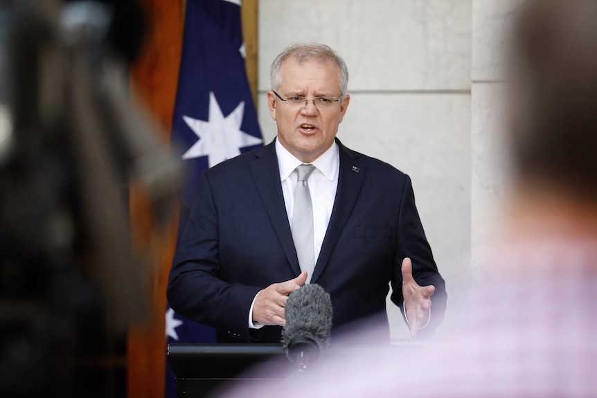 Scott Morrison mid-speech outside Parliament House.