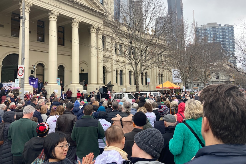 A crowd gathers outside Trades Hall in Melbourne at the Come Together For Yes rally