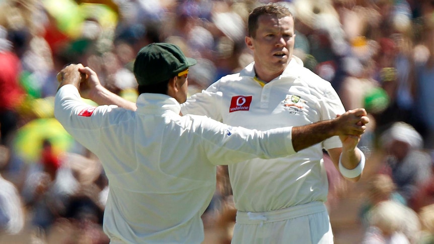 Peter Siddle (right) celebrates with Ricky Ponting