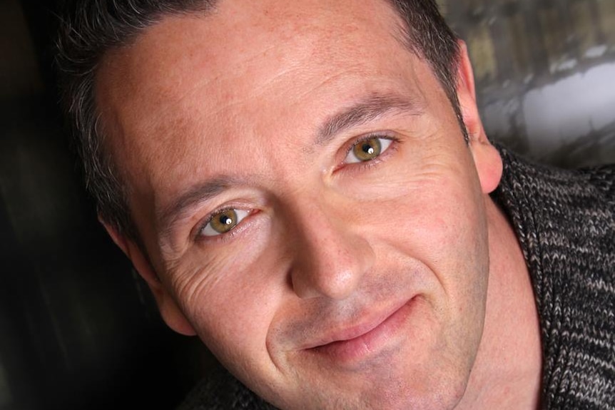 John Edward poses for a photo