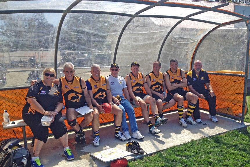 Players on bench during an AFL masters game