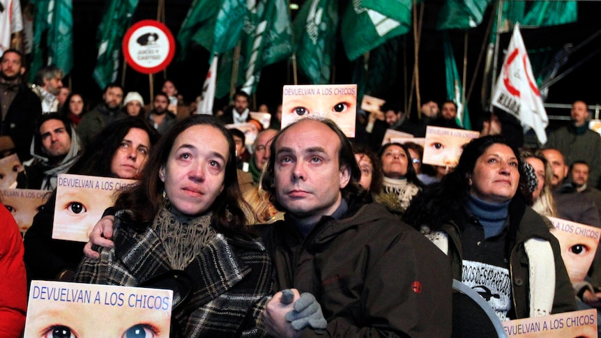 Members of human rights groups react after hearing the verdict in the trial of former Argentine dictator Jorge Videla.