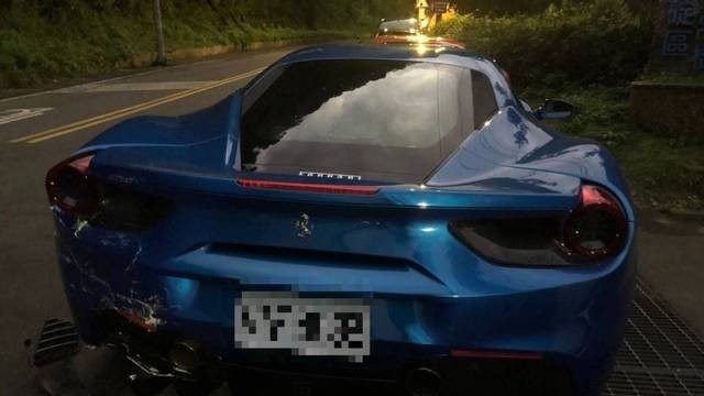 Bumper damage to the blue Ferrari.