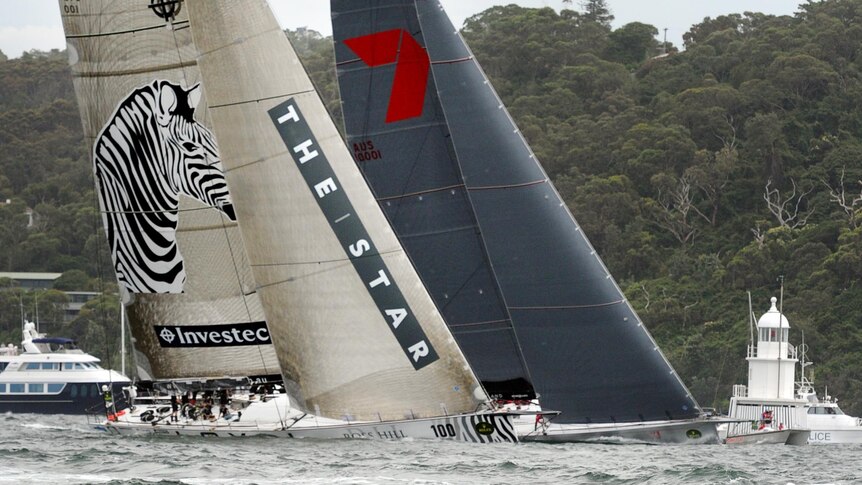 LtoR Investec LOYAL and Wild Oates XI race at the start of the Sydney to Hobart yacht race.