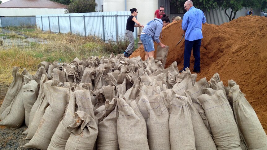 People fill sandbags ahead of expected flooding in Tallygaroopna.