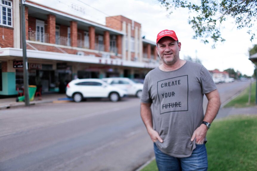 Mark Melrose organiser at Vision Splendid Outback Film Festival stands in the street in Winton