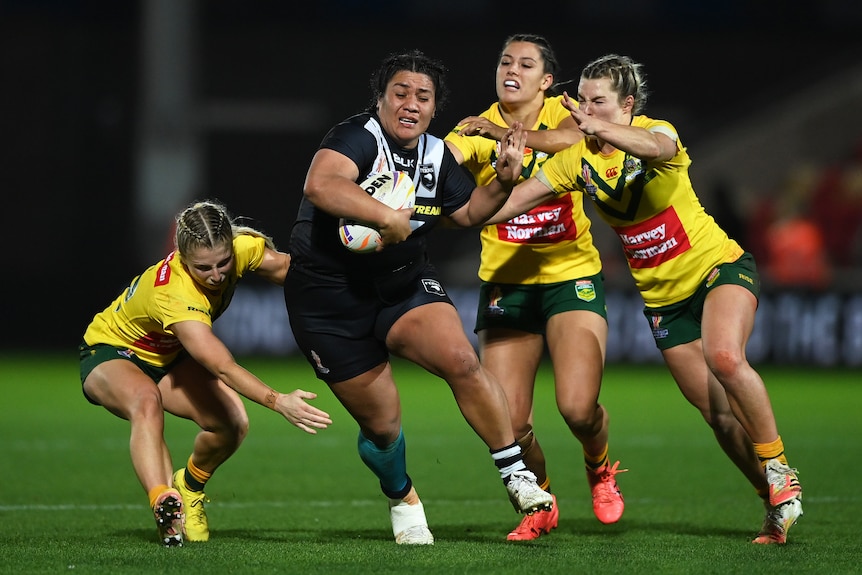 New Zealand's Amber Hall carries the ball against the Jillaroos