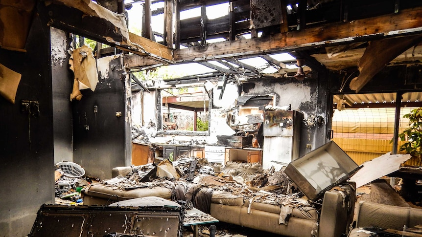 Charred remains of kitchen and lounge room after fire destroyed hostel in Robinvale Victoria