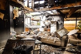 Charred remains of kitchen and lounge room after fire destroyed hostel in Robinvale Victoria