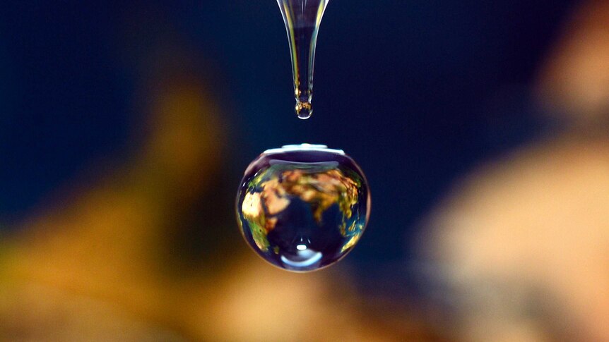 Water drop reflects world map