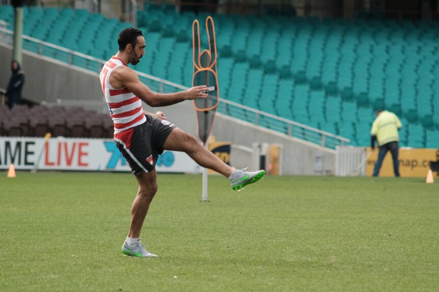 Adam Goodes kicks at Sydney Swans training