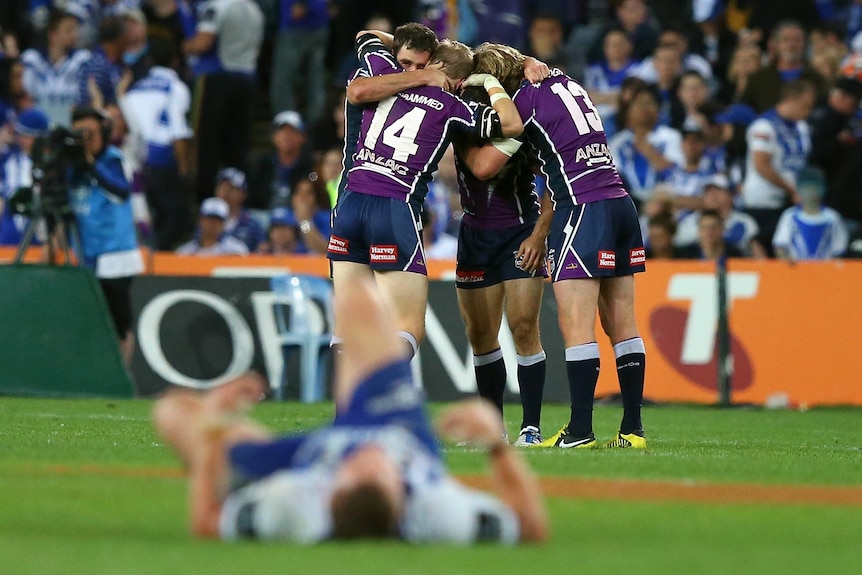The Melbourne Storm celebrate defeating the Canterbury Bulldogs 14-4 in the 2012 NRL grand final.