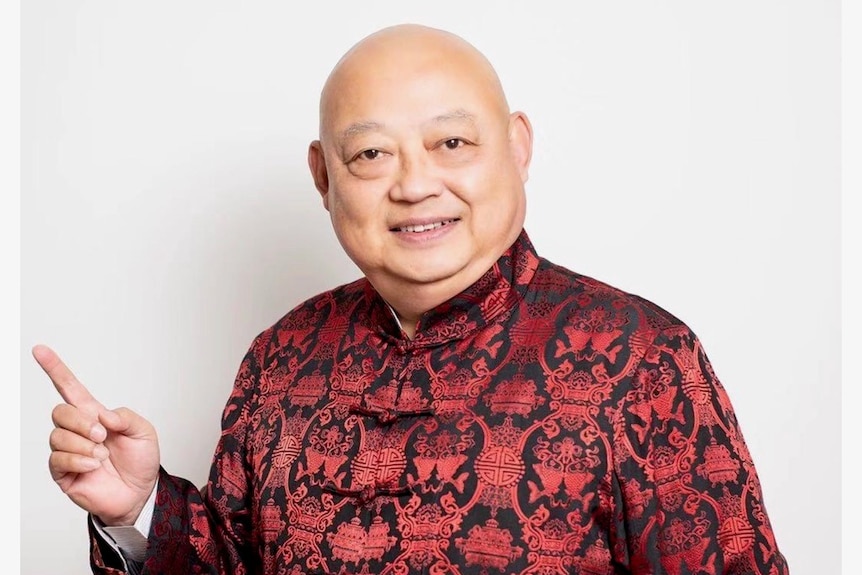 Man in traditional Chinese costume looking forward