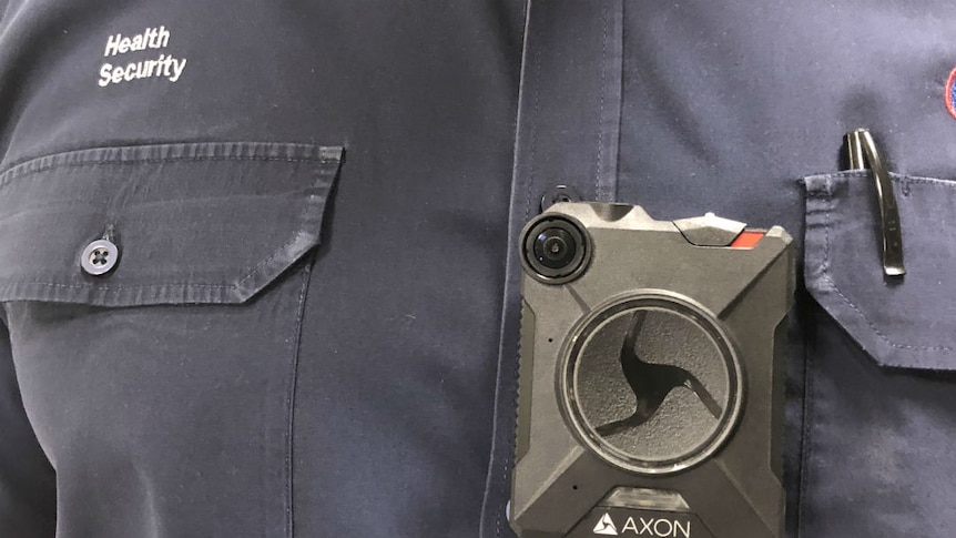 A close-up of a body camera on a security guard's chest