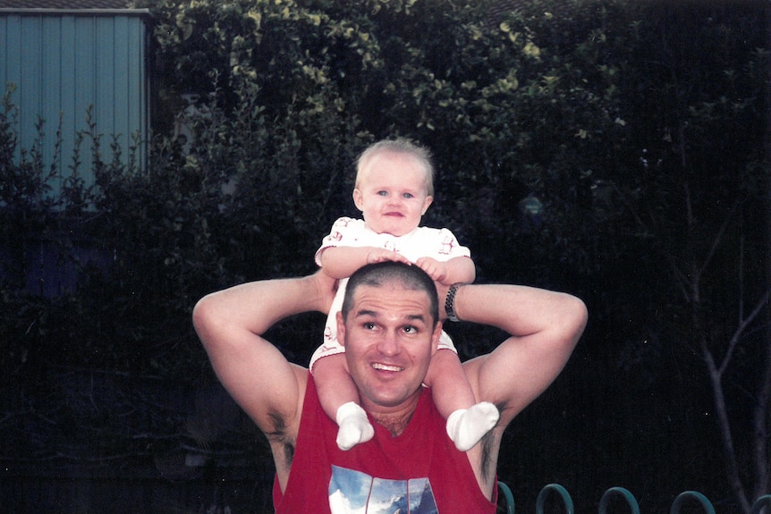 Luka rides on the shoulders of his father Clay.