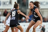 Carlton's Alison Downie (R) celebrates a goal with Georgie Gee against Collingwood in round 1, 2018.