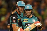 Chris Lynn and Brendon McCullum stand together in the Brisbane Heat uniforms.