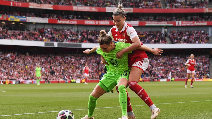 Steph Catley challenges Svenja Huth during Champions League semifinal