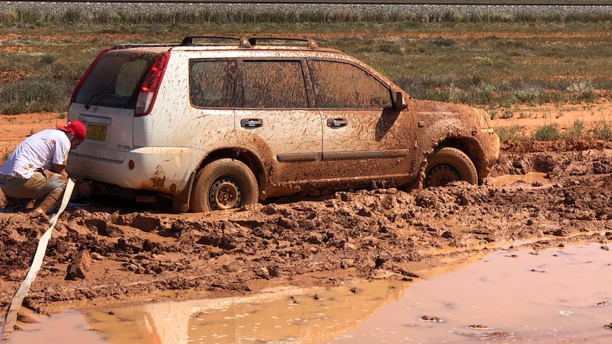 Bogged car about to get towed in outback New South Wales