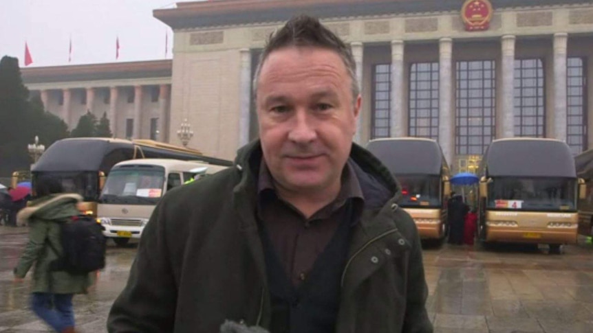 Stephen McDonell stands outside a parliament building in beijng for a piece to camera
