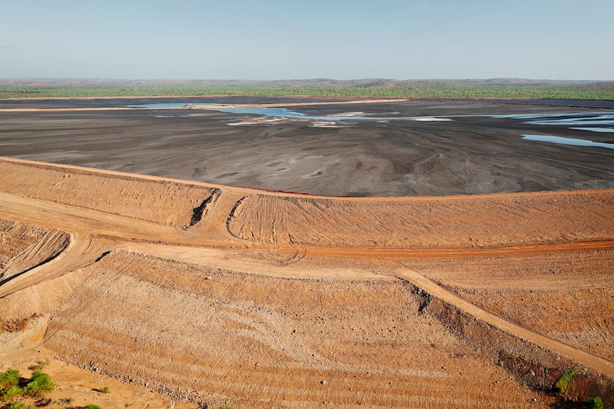 A large lead and zinc mine's waste minerals storage facility seen from above.