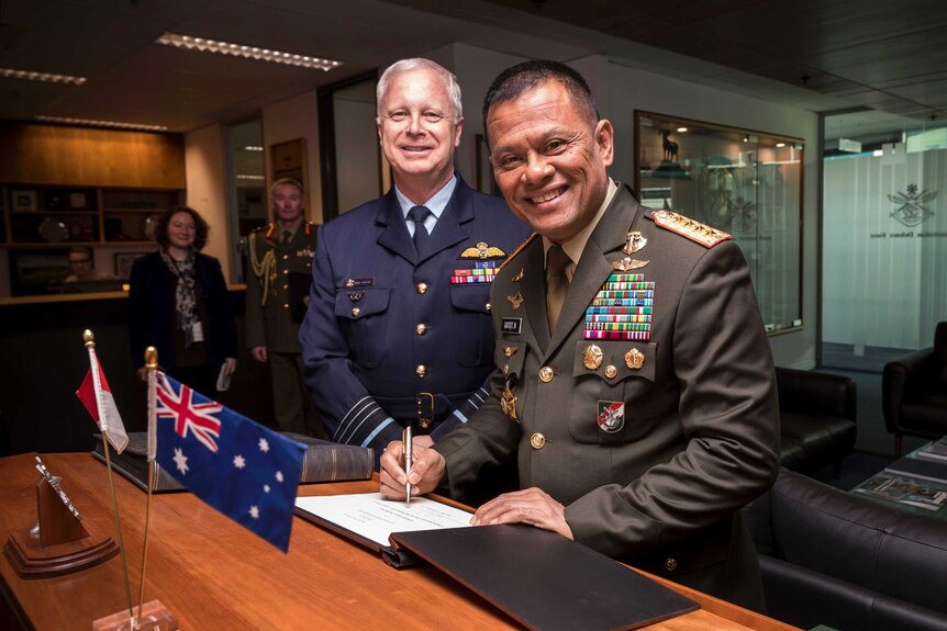 Air Chief Marshal Mark Binskin and General Gatot Nurmantyo shake hands in Canberra