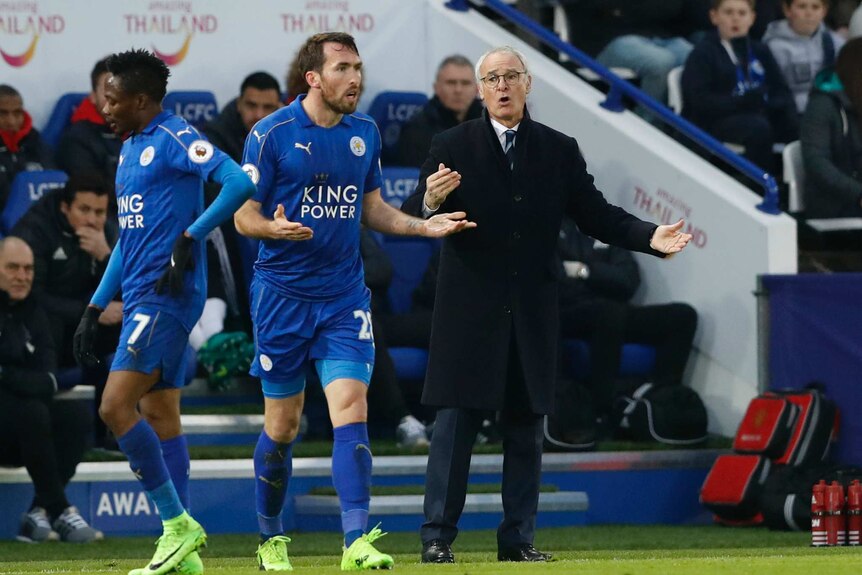Leicester manager Claudio Ranieri and Christian Fuchs react against Manchester United