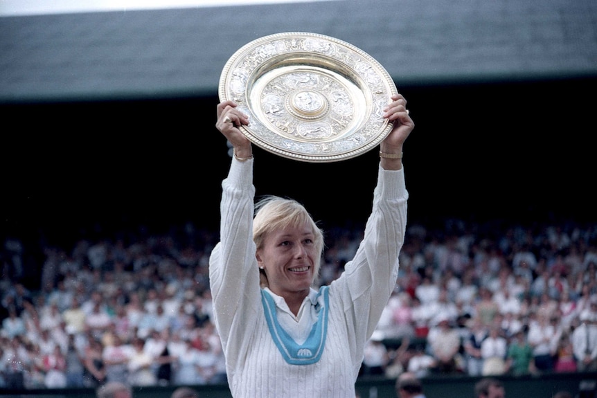 Martina Navratilova holds up the Wimbledon silverware after winning the 1985 title